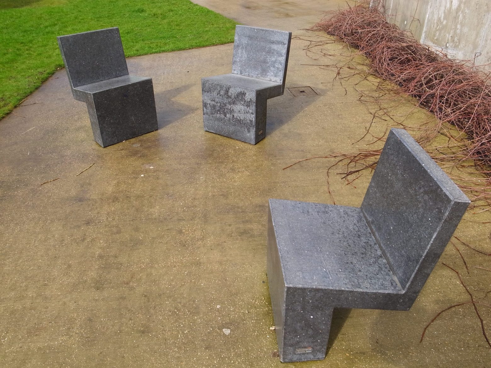 Three empty concrete seats
